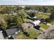 This aerial view shows the cozy neighborhood, mature trees, and well-maintained lawns of each unique home at 919 Timor Ave, Orlando, FL 32804