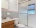 Cozy bathroom featuring a shower and tub with glass sliding doors at 919 Timor Ave, Orlando, FL 32804