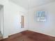 Bedroom featuring a window, a door, and neutral colors at 919 Timor Ave, Orlando, FL 32804