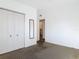 A bedroom featuring a closet and entryway to a full bathroom at 919 Timor Ave, Orlando, FL 32804
