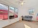 Well-lit room featuring a fan, multiple windows, and an external view of the property at 919 Timor Ave, Orlando, FL 32804