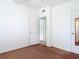 Neutral bedroom featuring carpet floors, a white ceiling fan and a large window at 919 Timor Ave, Orlando, FL 32804