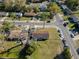 An aerial view showcases a cozy home with a spacious yard on a corner lot in a quiet neighborhood at 925 Valleydale Ave, Deland, FL 32720