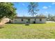 Spacious backyard with lush lawn and patio, perfect for outdoor activities at 925 Valleydale Ave, Deland, FL 32720