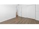 Bedroom with wood-look flooring, closet and bathroom access at 925 Valleydale Ave, Deland, FL 32720