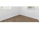 Empty bedroom featuring vinyl floors and two windows at 925 Valleydale Ave, Deland, FL 32720