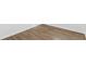 Close up of wood-look flooring and baseboards at 925 Valleydale Ave, Deland, FL 32720