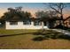 Charming single-story home with neutral paint, tidy landscaping, and a convenient attached carport at 925 Valleydale Ave, Deland, FL 32720