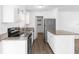 Well-lit kitchen with stainless steel appliances and sleek granite countertops at 925 Valleydale Ave, Deland, FL 32720