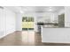 Open kitchen featuring stainless steel appliances, granite countertops, and easy access to the backyard at 925 Valleydale Ave, Deland, FL 32720