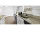 Bright kitchen with stainless steel appliances, granite countertops, and a view of the backyard at 925 Valleydale Ave, Deland, FL 32720