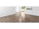 Bright living room featuring wood-look flooring and a sliding glass door to the backyard at 925 Valleydale Ave, Deland, FL 32720