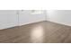 Clean interior with wood-look flooring, a white door, and an airy, open feel at 925 Valleydale Ave, Deland, FL 32720
