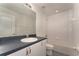 Clean bathroom featuring a single vanity, and combined shower and tub at 10033 Hidden Dunes Ln, Orlando, FL 32832