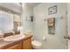 Cozy bathroom featuring a pedestal sink, toilet, and decorative accents at 10033 Hidden Dunes Ln, Orlando, FL 32832