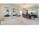 Inviting dining area with chandelier, classic wood table, and unique mirrored display cabinets at 10033 Hidden Dunes Ln, Orlando, FL 32832