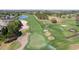 Aerial view of a beautiful golf course featuring well-maintained greens, sand traps, and an efficient sprinkler system for optimal play at 10033 Hidden Dunes Ln, Orlando, FL 32832