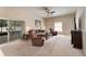 Spacious living room with sliding glass doors and comfortable seating, perfect for relaxation at 10033 Hidden Dunes Ln, Orlando, FL 32832