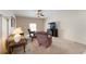 Comfortable living room with neutral carpeting, ceiling fan, and a modern fireplace entertainment center at 10033 Hidden Dunes Ln, Orlando, FL 32832