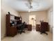 Home office with dual workstations, carpet and overhead lighting at 10033 Hidden Dunes Ln, Orlando, FL 32832