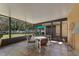 Enclosed patio has tile flooring with furnishings for outdoor living at 10033 Hidden Dunes Ln, Orlando, FL 32832