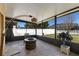 Covered patio has tile flooring and features outdoor seating and lighting at 10033 Hidden Dunes Ln, Orlando, FL 32832