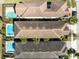 Aerial view featuring luxury homes, pools, and lush landscaping in a resort-style community at 1004 Castle Pines Ct, Reunion, FL 34747