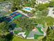 An aerial view of the community's amenities which include tennis, mini golf, playground, and swimming pool at 1004 Castle Pines Ct, Reunion, FL 34747