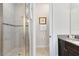Beautiful bathroom with a glass shower, and a toilet room separated by an open doorway at 1004 Castle Pines Ct, Reunion, FL 34747