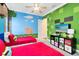 Cheerful bedroom with Minecraft-themed decor, two beds, and vibrant green and blue walls at 1004 Castle Pines Ct, Reunion, FL 34747