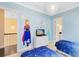 Charming bedroom with themed decor, two beds, and whimsical artwork on the walls at 1004 Castle Pines Ct, Reunion, FL 34747
