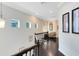 Upstairs hallway with dark wood floors and natural light at 1004 Castle Pines Ct, Reunion, FL 34747