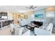 Open-concept living room provides a comfortable setting and is adjacent to kitchen and dining area at 1004 Castle Pines Ct, Reunion, FL 34747