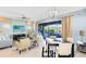 Bright and inviting living space features a dining area and access to an outdoor patio with grill at 1004 Castle Pines Ct, Reunion, FL 34747