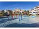 Community splash pad and playground, perfect for Gathering fun in a resort setting at 1004 Castle Pines Ct, Reunion, FL 34747