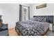 Bedroom featuring a black and white floral comforter and a large window at 102 Ethan Ave, Davenport, FL 33897