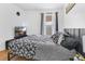 Bedroom featuring a black and white floral comforter and a large window at 102 Ethan Ave, Davenport, FL 33897