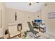 Bright bedroom features tiled floors, neutral walls, and ceiling fan, creating a versatile space for living at 102 Ethan Ave, Davenport, FL 33897