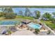 A stunning community pool, playground, and tennis court are surrounded by a beautiful lake view at 102 Ethan Ave, Davenport, FL 33897