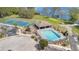 A community pool, playground, and tennis court are next to a stunning lake at 102 Ethan Ave, Davenport, FL 33897