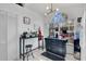 Bright kitchen featuring an island, tile floors, and a large window at 102 Ethan Ave, Davenport, FL 33897