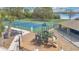 A beautiful view of the community playground and tennis court with a picnic area at 102 Ethan Ave, Davenport, FL 33897