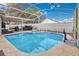 Refreshing pool and spa with enclosed screen, offering a private oasis for relaxation and recreation at 102 Ethan Ave, Davenport, FL 33897