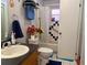 Bathroom featuring a vanity sink, a tiled shower with curtains, and decorations at 10223 Marco Polo Dr, Orlando, FL 32821