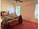 Bedroom featuring a window for natural light and a ceiling fan at 10223 Marco Polo Dr, Orlando, FL 32821
