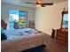 Bright bedroom with a sliding glass door, wood floors, and a comfortable bed at 10223 Marco Polo Dr, Orlando, FL 32821