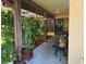 Inviting covered front porch featuring lush greenery and charming decorative accents at 10223 Marco Polo Dr, Orlando, FL 32821