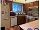 Functional kitchen featuring wood cabinets and essential appliances at 10223 Marco Polo Dr, Orlando, FL 32821