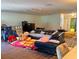 Spacious living room with laminate flooring and a large sofa for relaxing and entertaining at 10223 Marco Polo Dr, Orlando, FL 32821