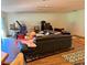 Large living room featuring laminate flooring and abundant natural light at 10223 Marco Polo Dr, Orlando, FL 32821